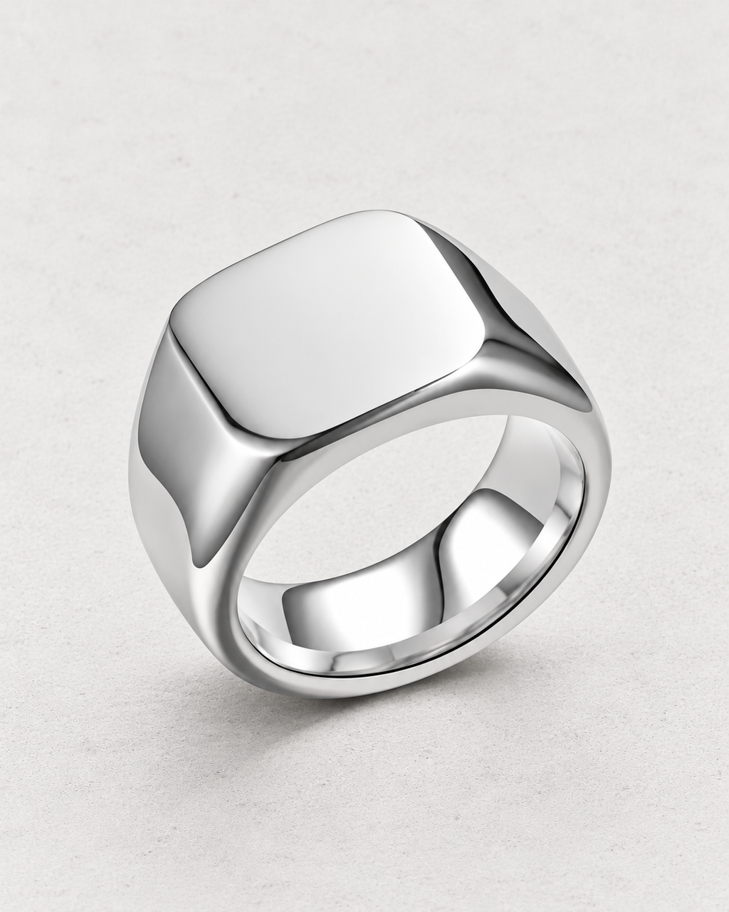 PARLX Axis Band rounded-square signet ring in polished steel on light concrete