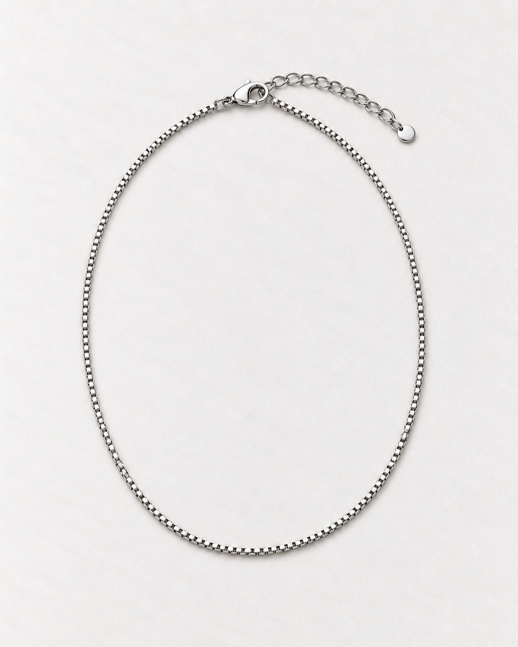 PARLX Box Chain Necklace in polished steel on light concrete — existing render with standardized catalog styling
