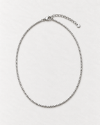 PARLX Box Chain Necklace in polished steel on light concrete — existing render with standardized catalog styling
