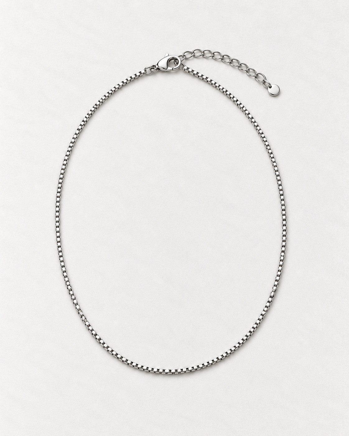 PARLX Box Chain Necklace in polished steel on light concrete — existing render with standardized catalog styling