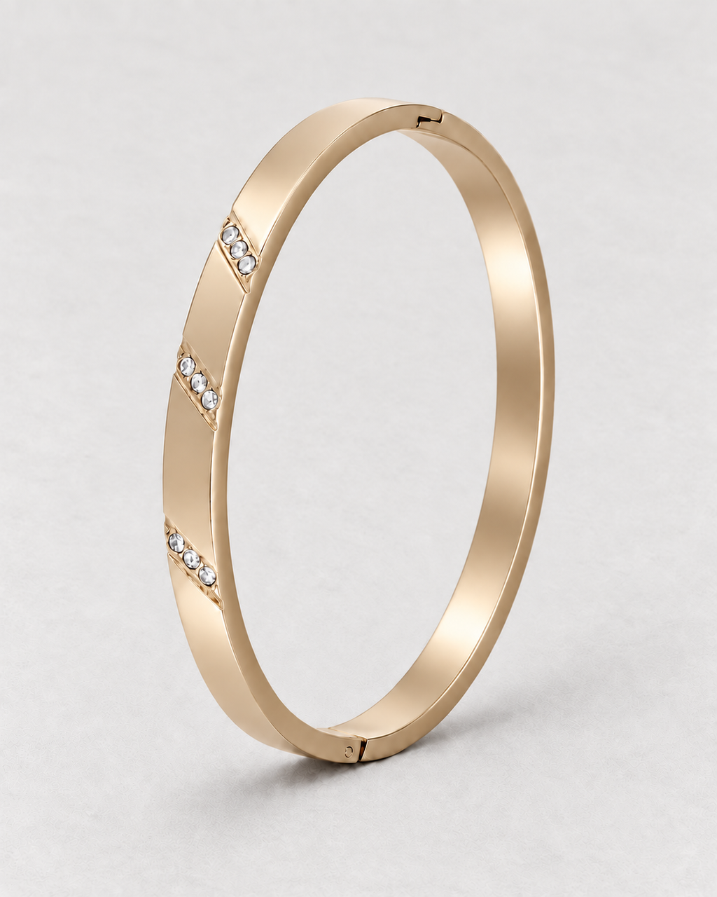 PARLX Channel Cuff in champagne gold tone on light concrete — supplier-referenced rendering