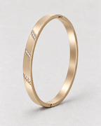 PARLX Channel Cuff in champagne gold tone on light concrete — supplier-referenced rendering