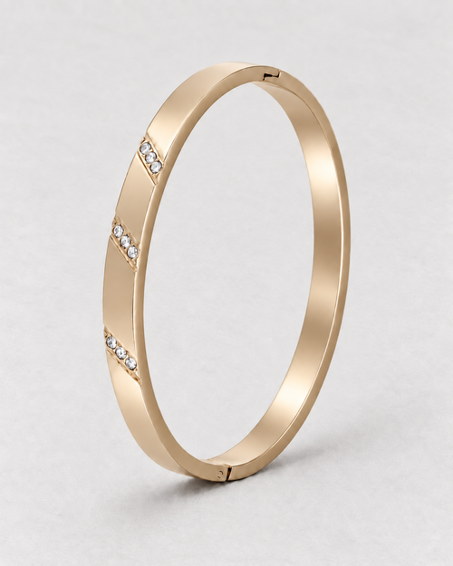 PARLX Channel Cuff in champagne gold tone on light concrete — supplier-referenced rendering