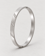 PARLX Channel Cuff in polished steel on pale matte concrete — supplier-referenced rendering