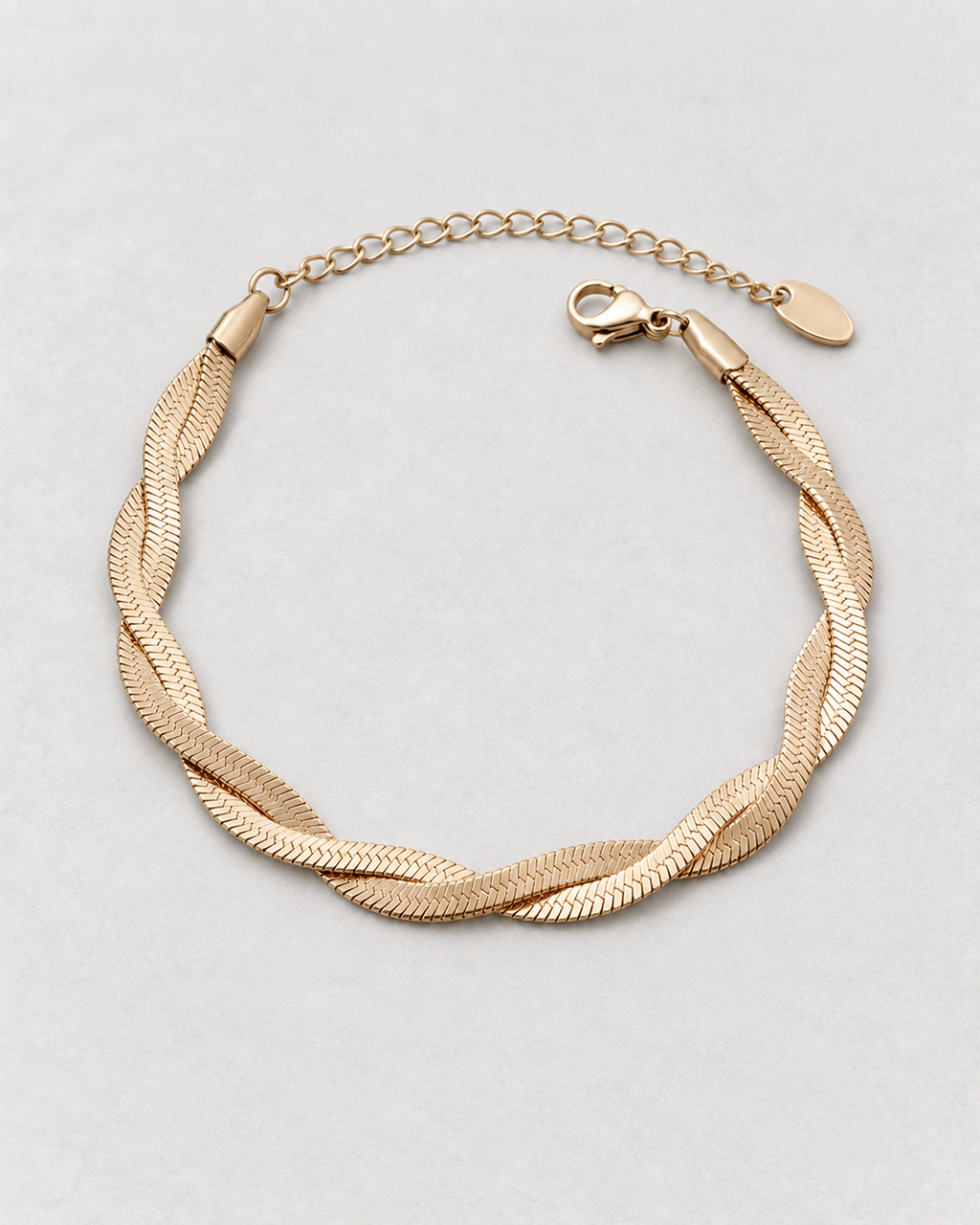 PARLX Intertwined Chain Bracelet in champagne gold tone on light concrete — supplier-referenced rendering