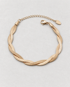 PARLX Intertwined Chain Bracelet in champagne gold tone on light concrete — supplier-referenced rendering
