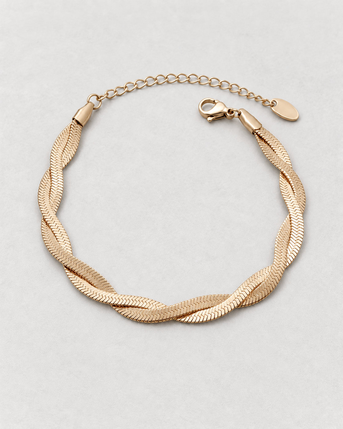 PARLX Intertwined Chain Bracelet in champagne gold tone on light concrete — supplier-referenced rendering