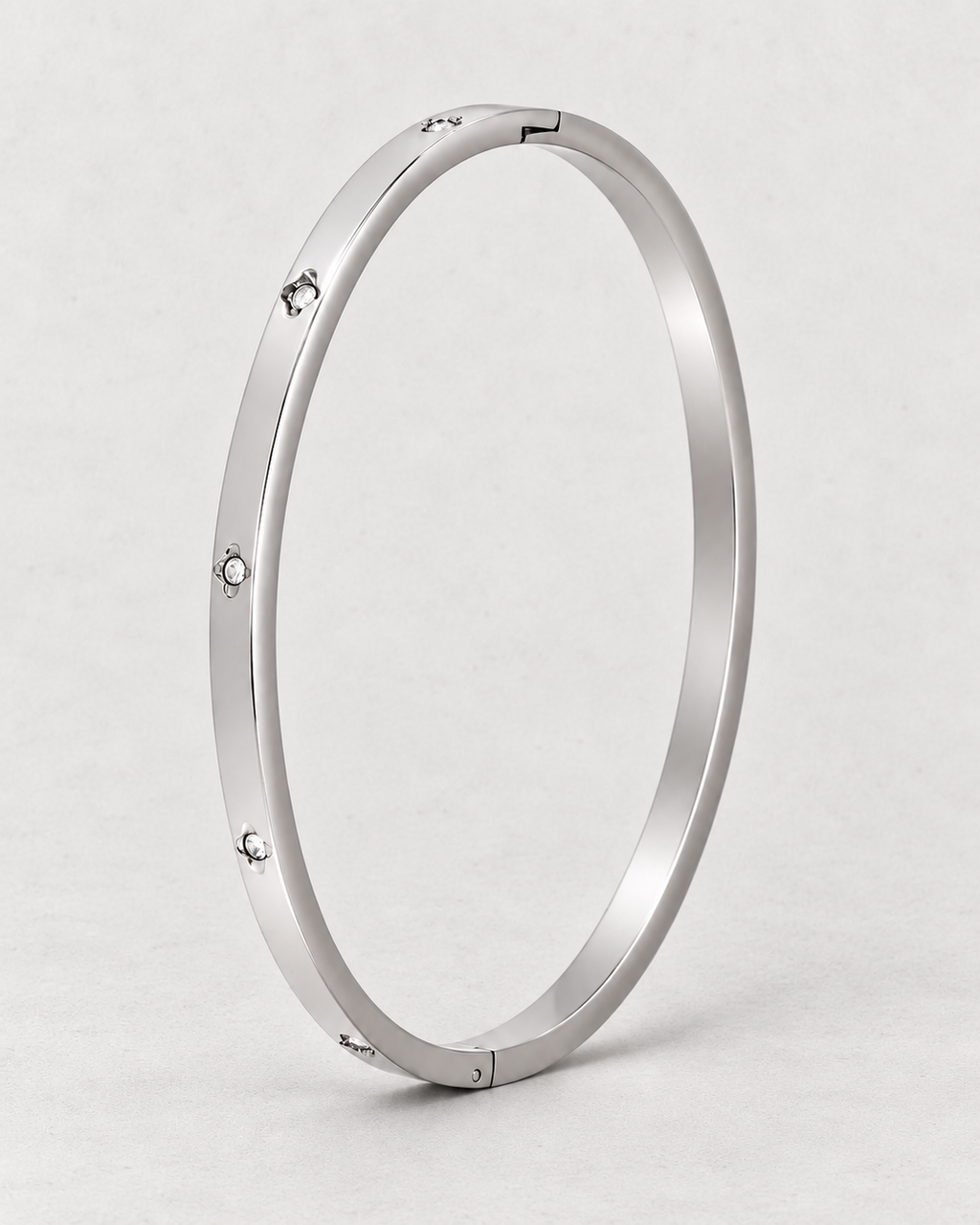 PARLX Solitaire Cuff — polished steel on light concrete, supplier-referenced rendering