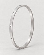 PARLX Solitaire Cuff — polished steel on light concrete, supplier-referenced rendering
