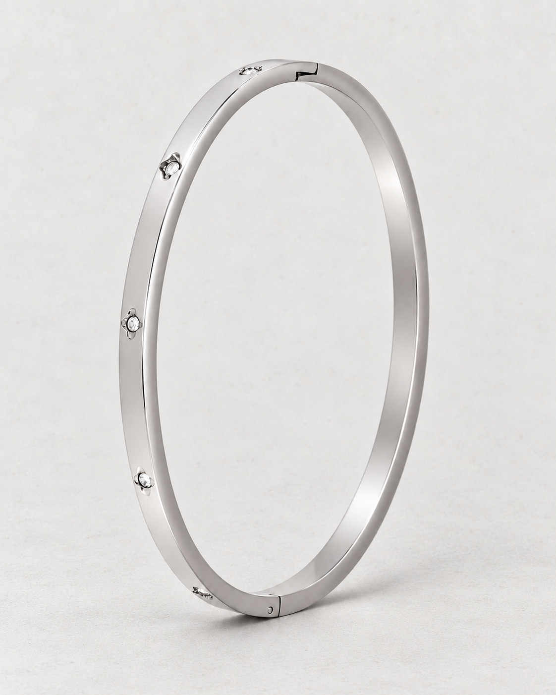 PARLX Solitaire Cuff — polished steel on light concrete, supplier-referenced rendering