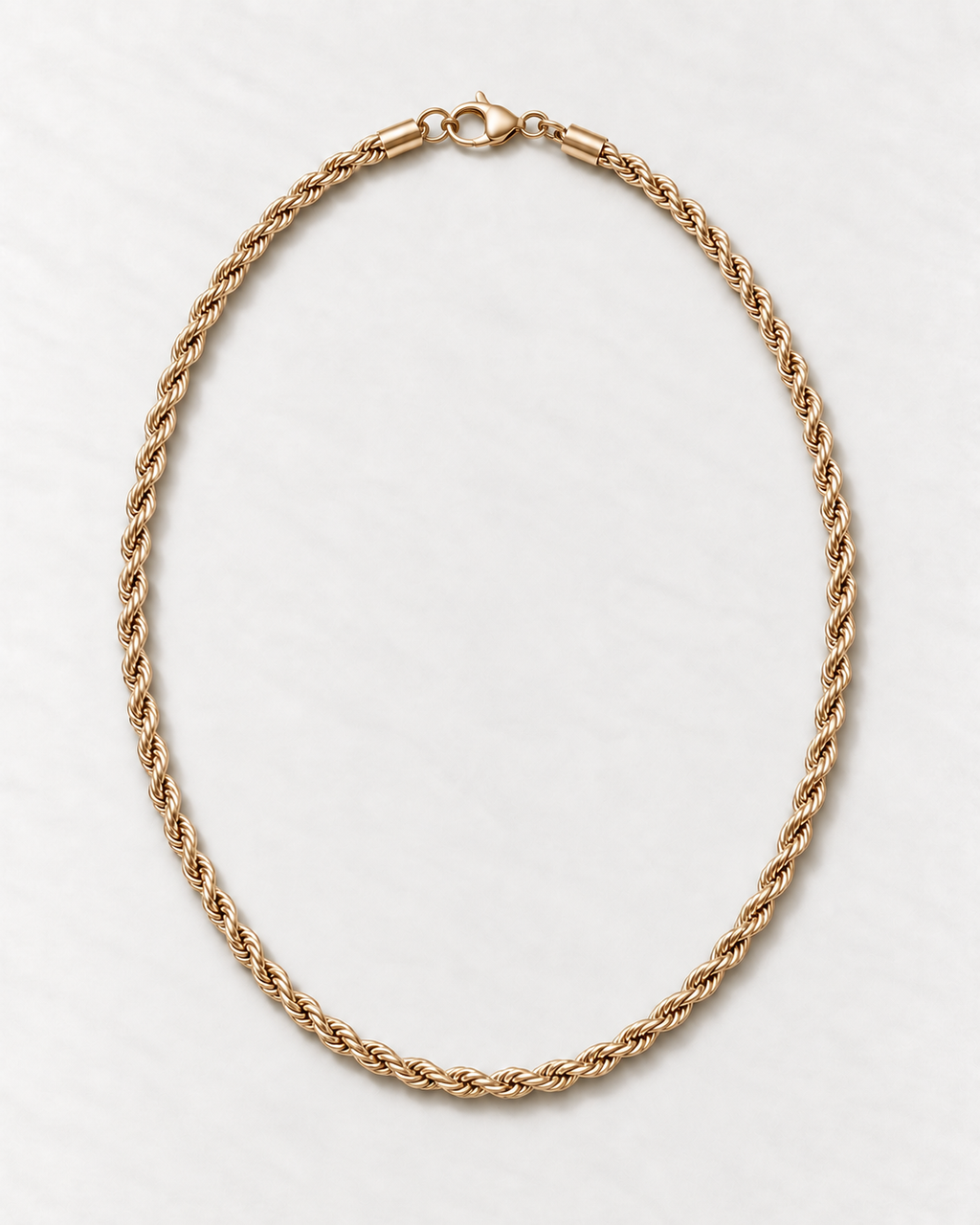 PARLX Twisted Chain Necklace in champagne gold tone on light concrete — existing render with standardized catalog styling