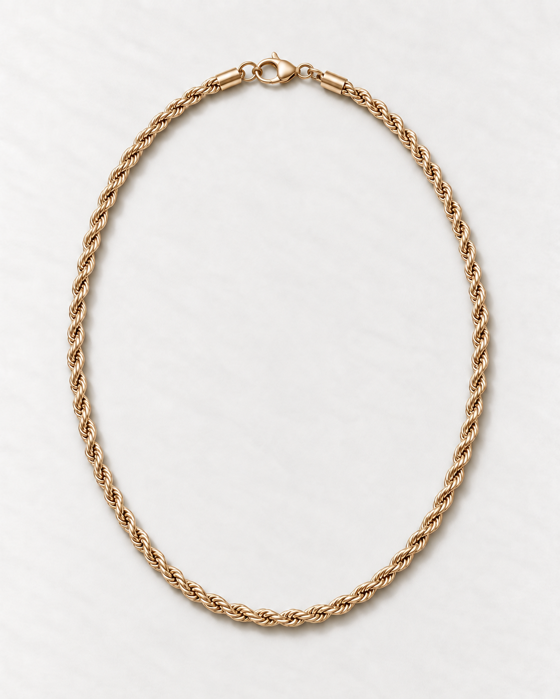PARLX Twisted Chain Necklace in champagne gold tone on light concrete — existing render with standardized catalog styling