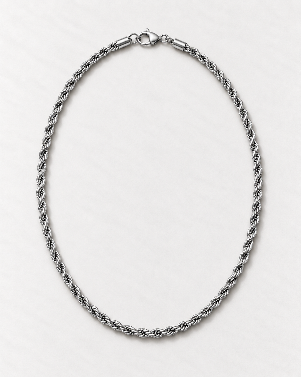 PARLX Twisted Chain Necklace in polished steel on light concrete — existing render with standardized catalog styling